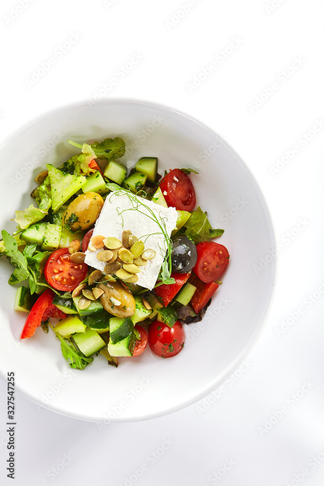 Greek salad in white bowl Greek salad in white bowl