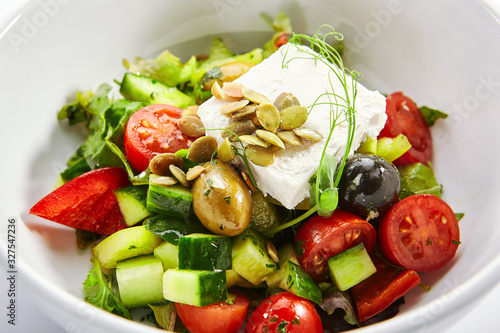 Greek salad in white bowl