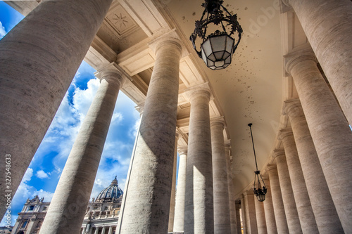 View through the colonnades at St. Peter's Square to St. Peter's Basilica in Rome Lazio Italy