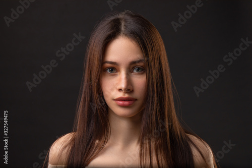 Fashion photo of beauty brunette woman on dark background