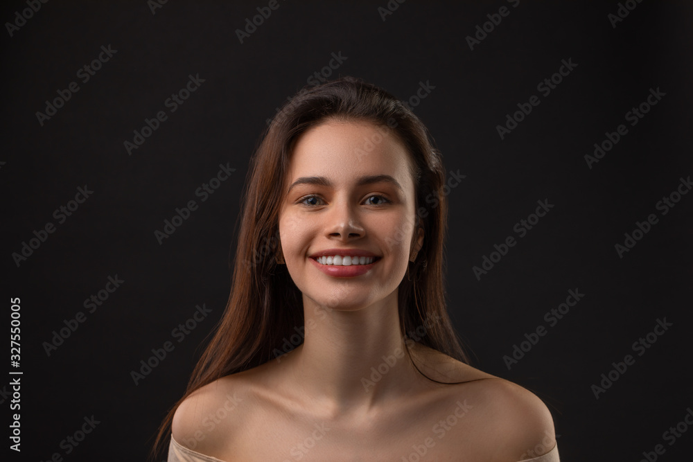 Closeup portrait of beautiful female fashion model on black background Closeup portrait of beautiful female fashion model on black background