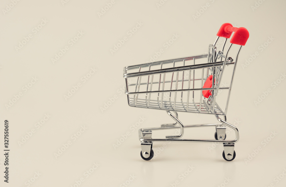 Empty shopping trolley on vintage background