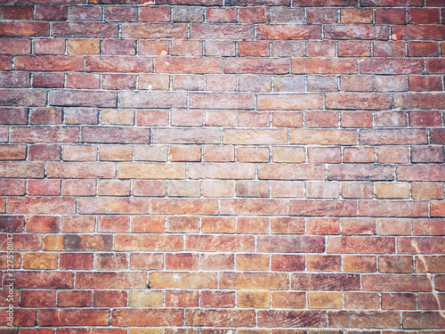 Brick wall background. Brown and red bricks, masonry texture of a building exterior