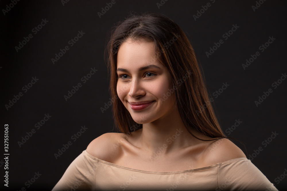close up portrait of beautiful smiley woman over black background close up portrait of beautiful smiley woman over black background