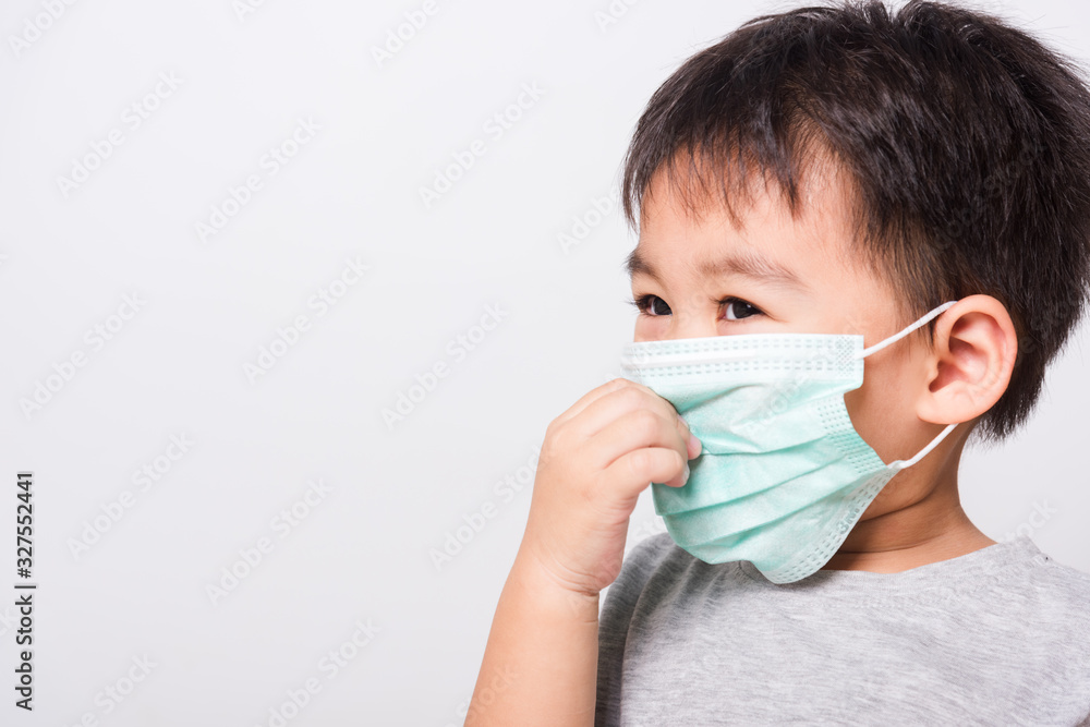 Closeup Asian face, Little children boy sick he using medicine healthcare mask Closeup Asian face, Little children boy sick he using medicine healthcare mask