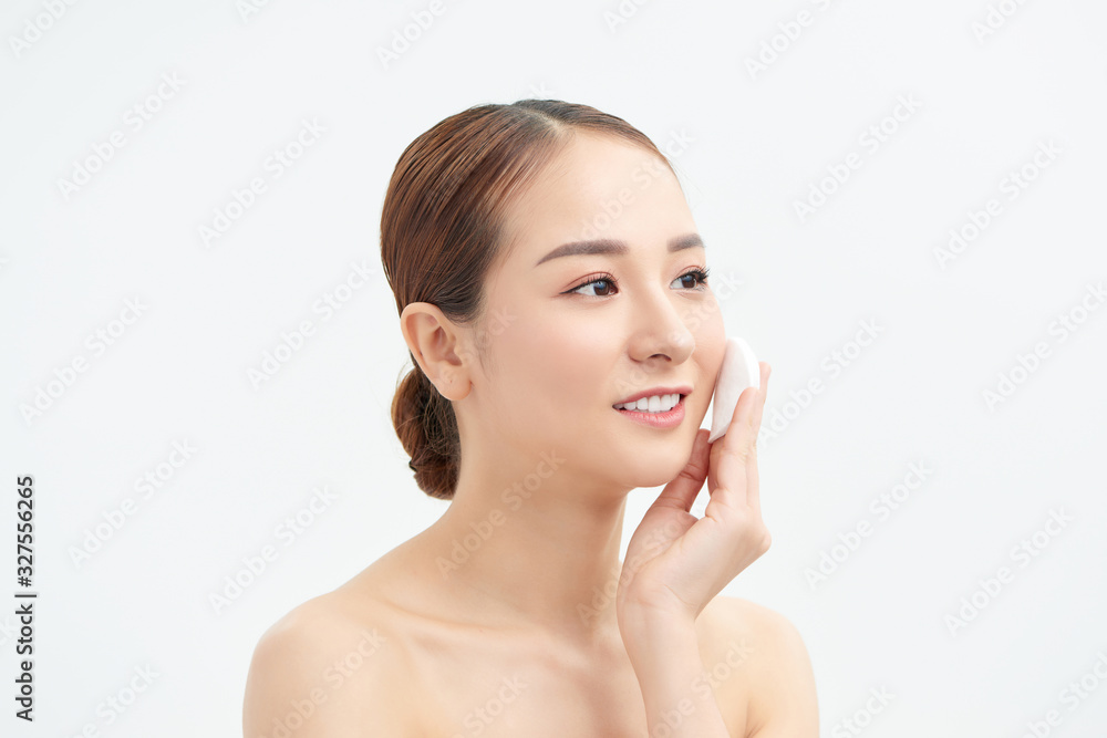Beautiful lady removing makeup from her face, skin care concept / photoset of attractive brunette girl on white background