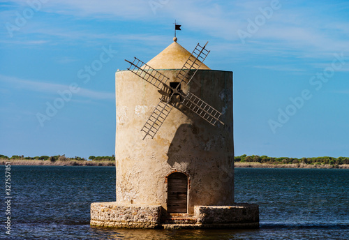 Old windmill in italy, tuscany. Standing in the water