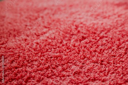 texture of bright pink Terry cloth in close-up with background blur