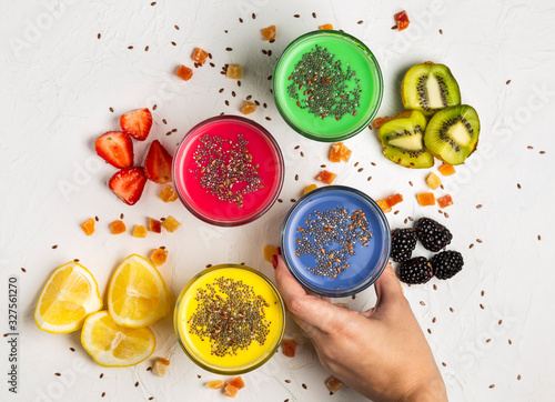 Flat lay colourful smoothies in glasses