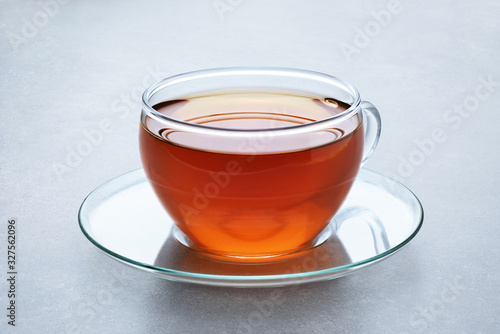Cup of tea on a gray background.