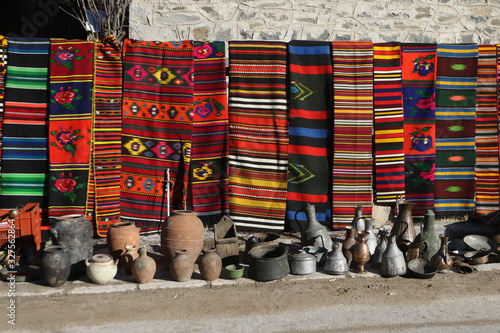 Colorful rugs in the Rhodope village of Shiroka Luka, Bulgaria photo