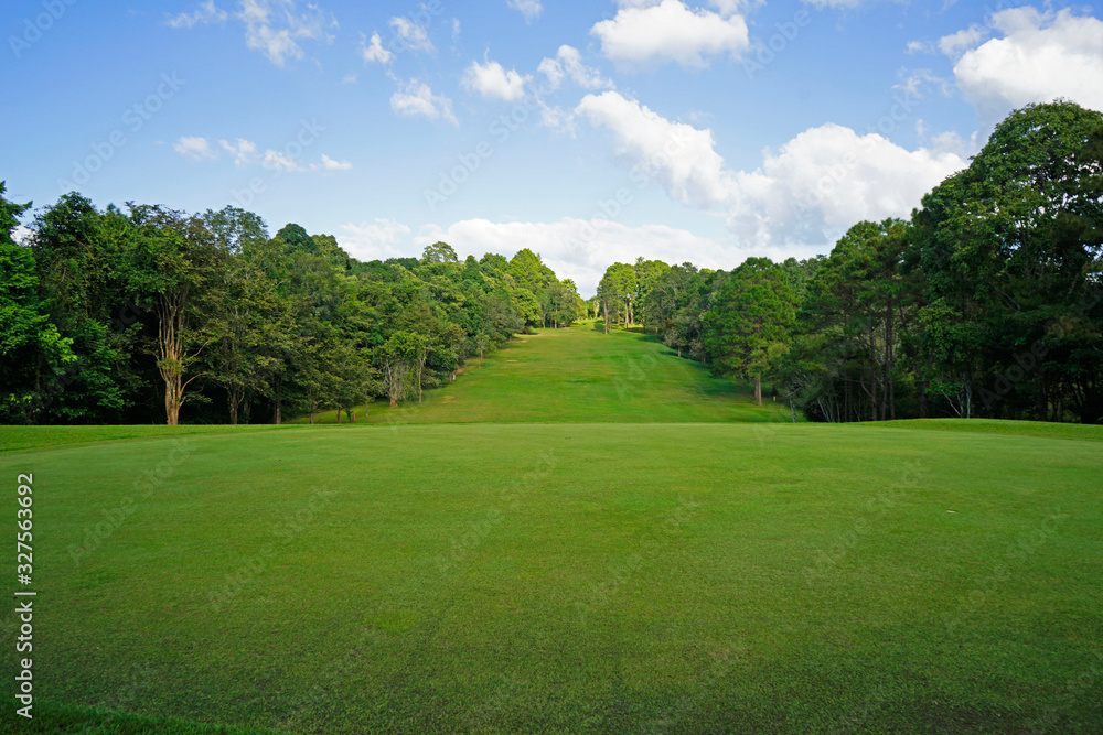The evening golf course has sunlight shining down at golf course in Thailand The evening golf course has sunlight shining down at golf course in Thailand