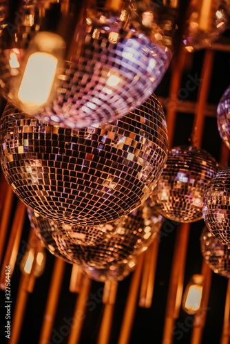 Mirror, disco ball, reflecting colorful lights.