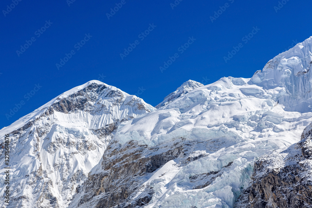 White snowy mountans with blue sky on clear day. Everest base camp view. Himalayas. Nepal.
