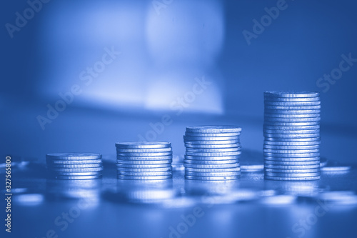 Stack of money coin wiht blue filter, Business and Financial background 