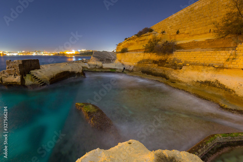 Rocky coastline of Malta landscape at night