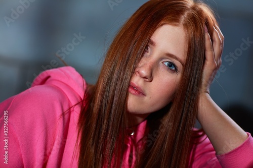 Closeup portrait of ginger woman looking at camera photo