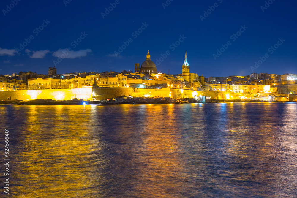 Coastline of Malta and the architecture of Valletta city at night