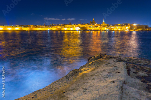 Coastline of Malta and the architecture of Valletta city at night