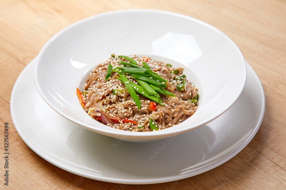 noodle with vegetables on the wooden background noodle with vegetables on the wooden background