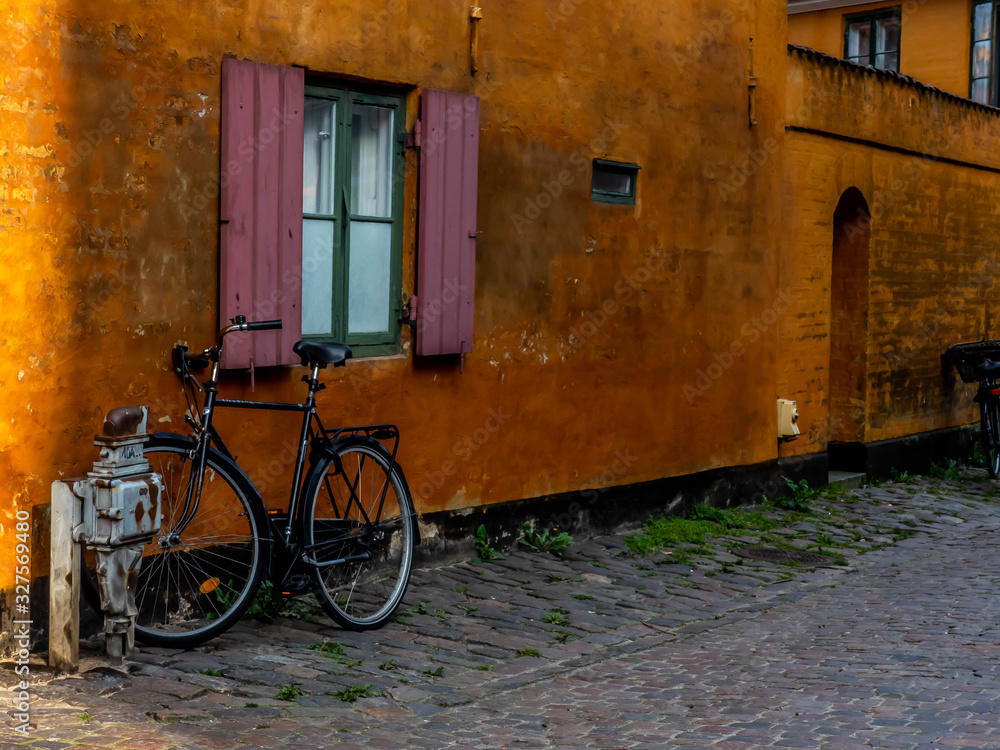 bicycle in front of old house