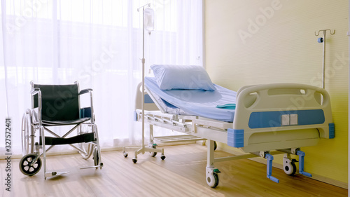 Fototapeta Naklejka Na Ścianę i Meble -  Hospital bed and wheelchair at hospital room.