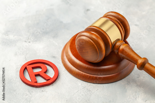 Judge gavel and red trademark sign