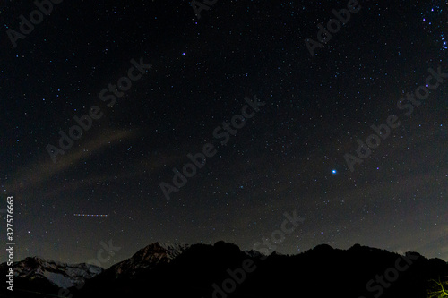 the stars and the night sky seen from the italian alps  during a fantastic winter night  near the town of Branzi  Italy - February 2020.