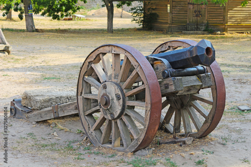 An old cannon on wheels