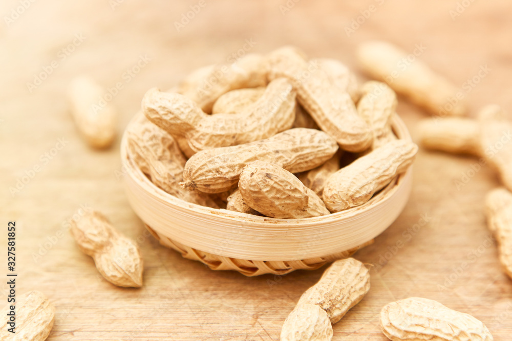 A pile of peanuts in a bamboo basket A pile of peanuts in a bamboo basket