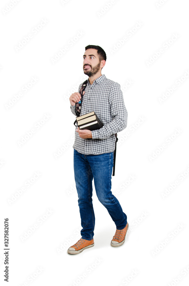 Full length picture of a young excited male student walking with a smile on his face. Isolated on white background Full length picture of a young excited male student walking with a smile on his face. Isolated on white background