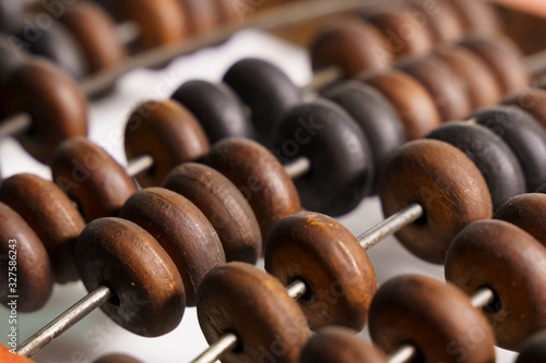 Wooden abacus on a white background.