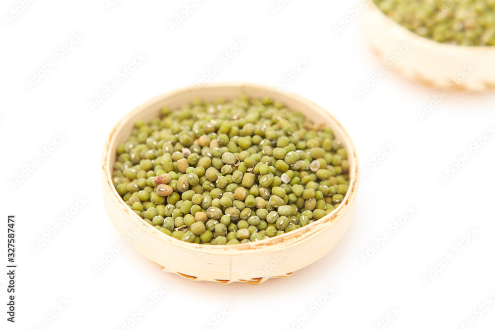 A pile of green beans in the bamboo basket A pile of green beans in the bamboo basket