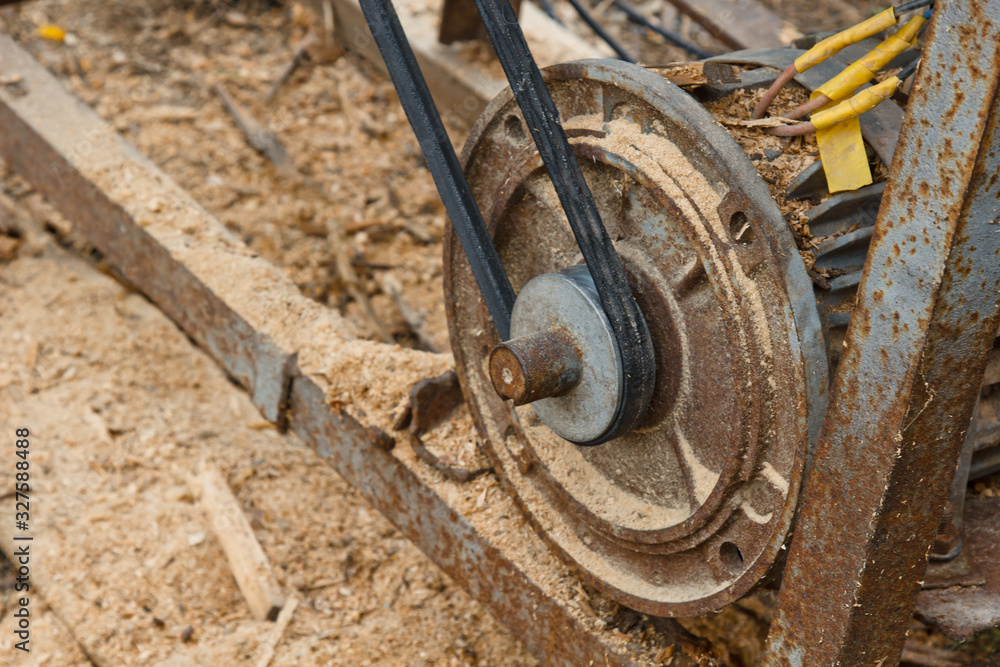 sawmill disks in a woodworking machine at a factory or a sawmill. mechanism. a lot of sawdust. sawmill disks in a woodworking machine at a factory or a sawmill. mechanism. a lot of sawdust.