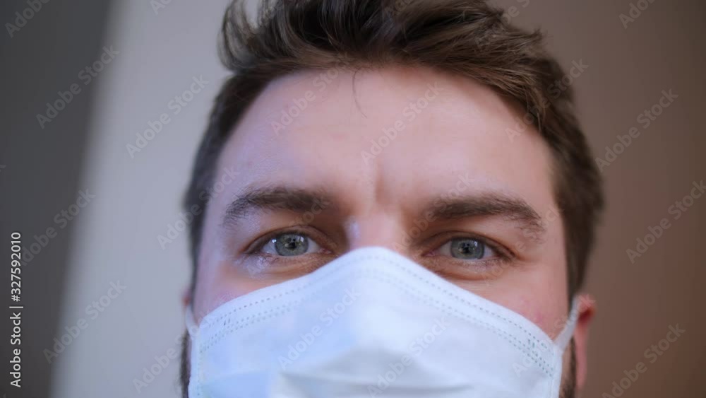 Coronavirus. Man in mask eyes close up. Pandemic disease. Health problem concept. Epidemic concept. Viruses attack. Coronavirus. Man in mask eyes close up. Pandemic disease. Health problem concept. Epidemic concept. Viruses attack.