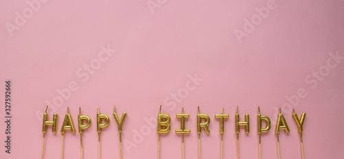 Happy Birthday golden candles on blue background. Golden birthday candles. Top view