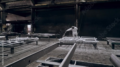 Painter varnishes in a  factory