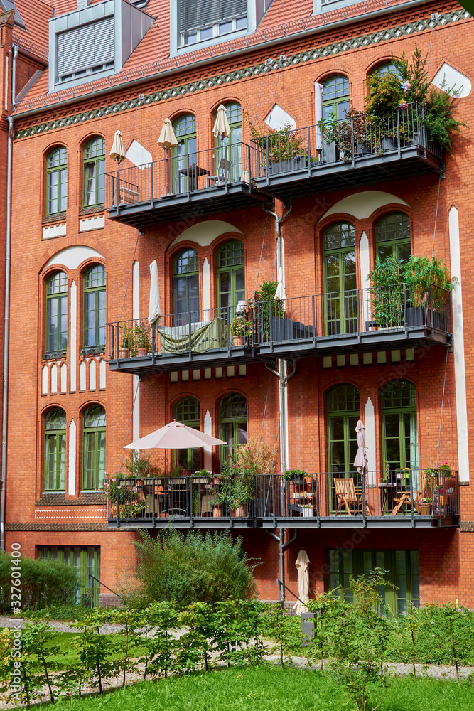 Back yard in Berlin with brick buildings, the facades of which have been extensively restored.