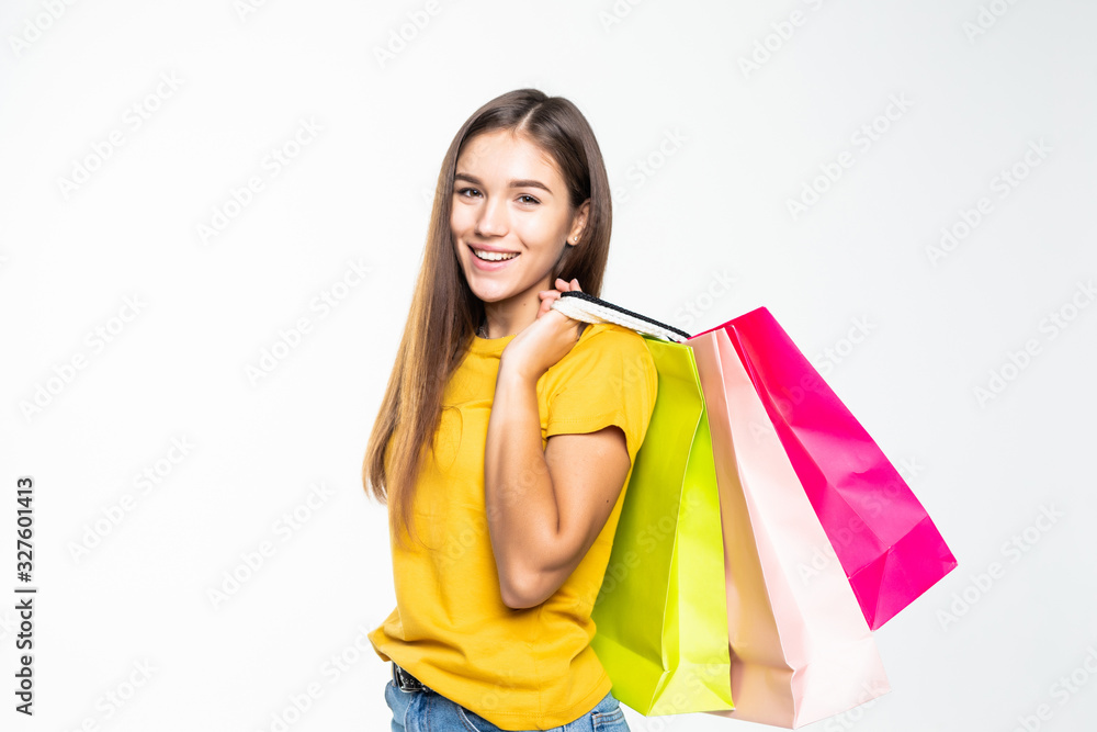 Portrait of young happy smiling woman with shopping bags over white background Portrait of young happy smiling woman with shopping bags over white background