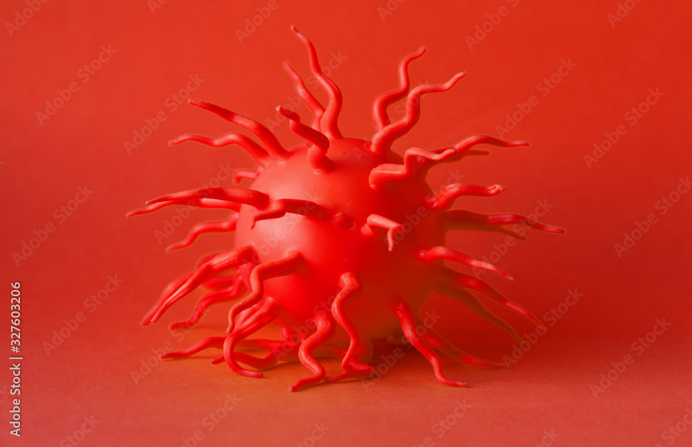 Fototapeta premium The red molecule of the virus on a red background. Selective focus. coronavirus nCoV 2019. Monocolor