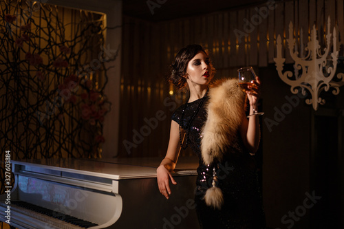 Portrait of 20s style festive beauty in a restaurant photo