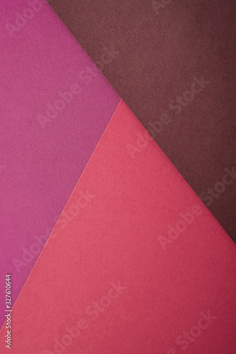 Paper triangle geometric texture in red, purple and brown colors