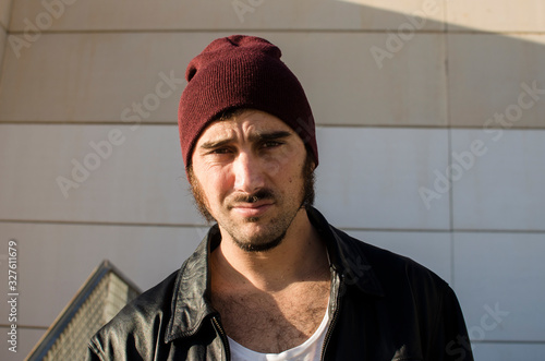 Photography young man with goatee looks defiant