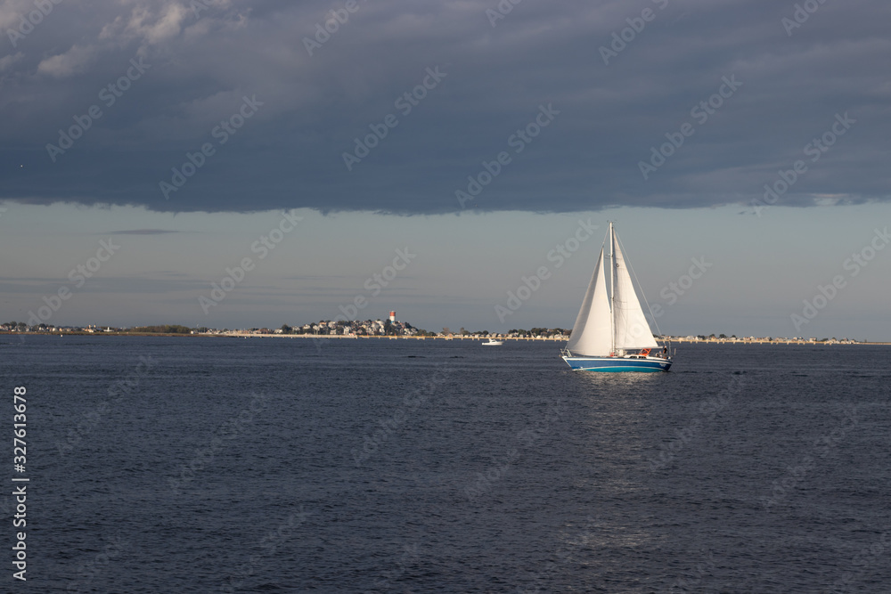 Fototapeta premium ocean sailboat at sunset