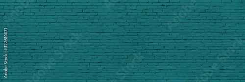 Panoramic Long And Wide Wall of Blue or Teal Bricks. Teal Wide Banner for Web With Textured Blue Surface. Luxury Facade or Face Wall in Trend Color.