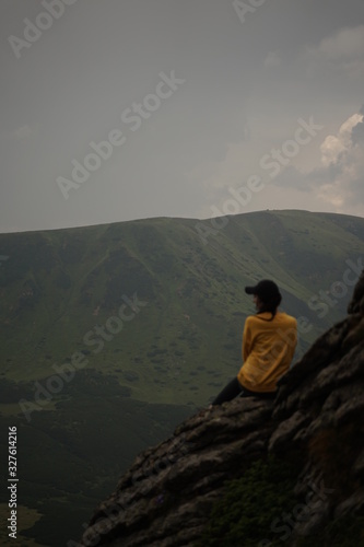 silhouette of woman on top of mountain