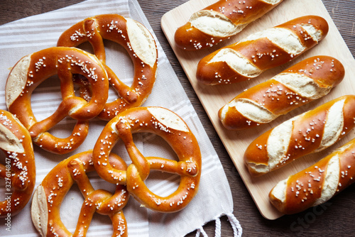 Closeup photo of lye bun and bavarian pretzel in bakery