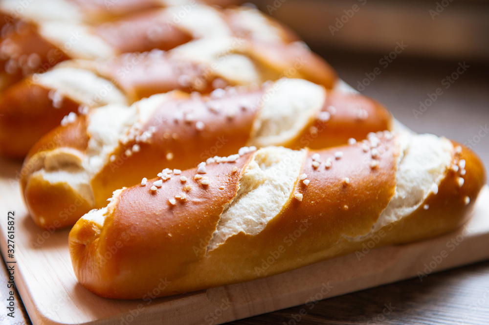 Closeup photo of lye bun and bavarian pretzel in bakery