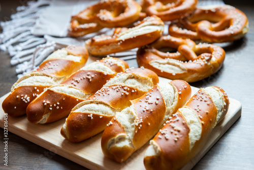 Photos Closeup photo of lye bun and bavarian pretzel in bakery