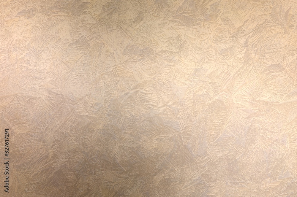 Fototapeta premium Decorative plaster beige textured background. Strokes of stucco pattern.